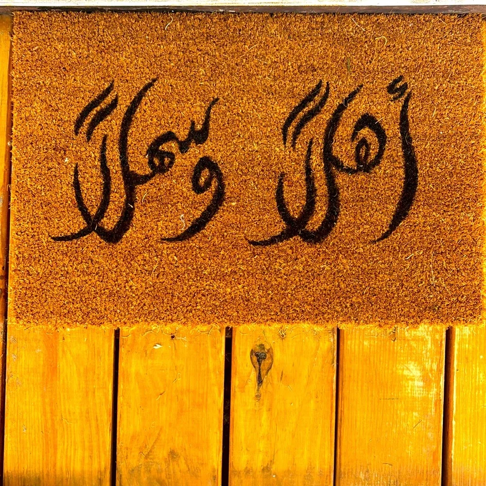 New never used. Small hand painted door mat